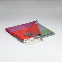 Load image into Gallery viewer, Colorful plaid blanket with fringes on a gray background
