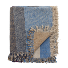 Load image into Gallery viewer, Multicolored woven blanket with frayed edges on a white background
