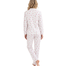 Load image into Gallery viewer, A woman viewed from the back wearing a matching long-sleeve pajama set with a white base and a small pink floral pattern, against a plain white background.
