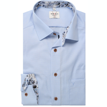 Load image into Gallery viewer, Light blue dress shirt with floral inner lining and cuffs on a white background
