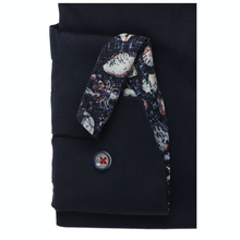 Load image into Gallery viewer, Navy shirt with a patterned tie on a black background
