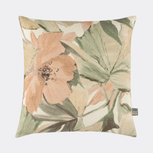 Load image into Gallery viewer, A square decorative throw pillow featuring a botanical watercolor-style print with large peach flowers and muted green leaves on a light cream background. A small 'The Boy' brand tag is visible in the bottom right corner.

