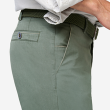 Load image into Gallery viewer, Green pants with a belt and white shirt on a light gray background
