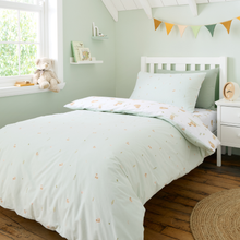 Load image into Gallery viewer, Children's bedroom with mint green bedding and cow bear decor.
