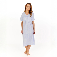Load image into Gallery viewer, Woman wearing a light blue patterned nightgown on a white background
