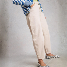 Load image into Gallery viewer, Side lower view oof model wearing White Stuff Aubrey Barrel Leg Jean in white, with a light grey background.
