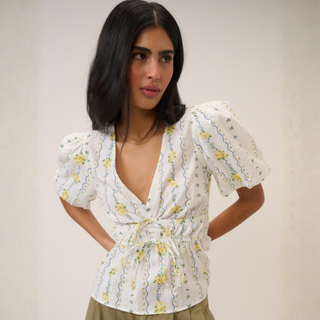 Lady in top on light background 