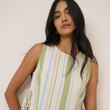 Load image into Gallery viewer, Woman wearing a sleeveless dress with vertical stripes against a plain background
