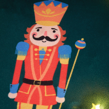 Load image into Gallery viewer, Colorful toy soldier with a mustache on a dark background
