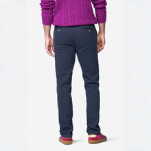 Load image into Gallery viewer, Rear view of a person wearing navy blue trousers, a purple cable-knit sweater, and red slip-on shoes against a light gray studio background.
