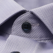 Load image into Gallery viewer, Close-up of a button on a textured fabric surface
