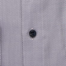 Load image into Gallery viewer, Close-up of a button on a textured gray fabric
