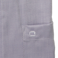 Load image into Gallery viewer, Close-up of a textured gray shirt with a small logo on a white background
