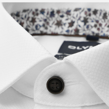 Load image into Gallery viewer, Close-up of a white dress shirt collar with a dark button, showing part of a patterned inner neck lining and a dark brand tag.
