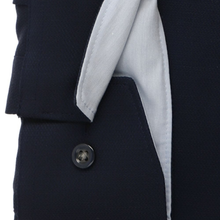 Load image into Gallery viewer, Close-up of a navy blue coat with a button and light gray lining on a white background
