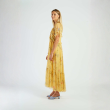 Load image into Gallery viewer, Woman wearing a yellow floral dress on a white background

