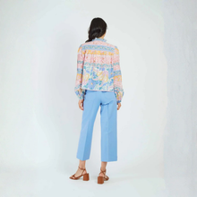 Load image into Gallery viewer, Person wearing a colorful patterned shirt and light blue pants on a white background
