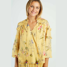 Load image into Gallery viewer, Woman wearing a yellow floral blouse on a white background
