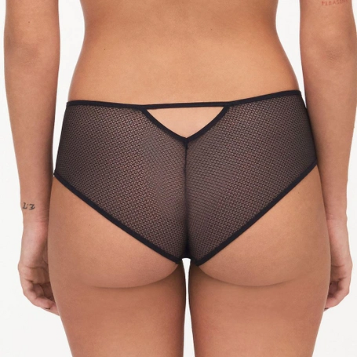 A close up shot of a model wearing the Passionata Olivia Shorty, showing the back detail.