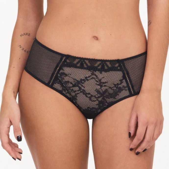 A close up of a model wearing the Passionata Olivia Shorty in Black.