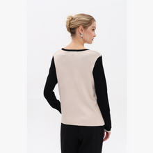 Load image into Gallery viewer, Woman wearing a black and beige long-sleeve top on a white background
