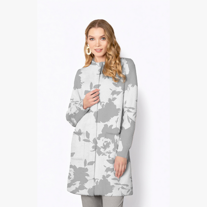 Woman wearing a gray and white floral patterned coat on a white background