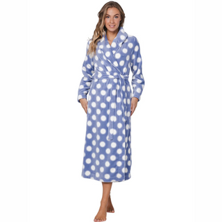 Woman wearing a blue polka dot robe on a white background