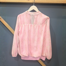 Load image into Gallery viewer, Back of Kate &amp; Pippa Bella Band Top Pink Mix, with a wooden and blue background.
