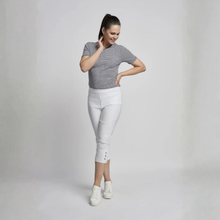 Load image into Gallery viewer, Woman wearing a striped shirt and white pants on a plain background
