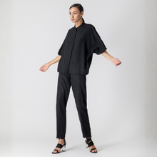 Load image into Gallery viewer, Woman wearing a black outfit on a white background
