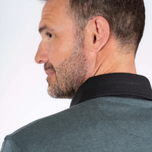 Load image into Gallery viewer, Man wearing a dark green shirt with a black collar on a white background
