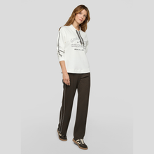 Load image into Gallery viewer, Full view of Model wearing, Rabe Leisure Wear Top White With Navy, with a grey background.
