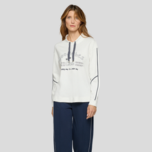 Load image into Gallery viewer, Model wearing, Rabe Leisure Wear Top White With Navy, with a grey background.
