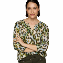 Load image into Gallery viewer, Closer image of Model wearing Rabe Animal Print Blouse  in Khaki, with a white background. 
