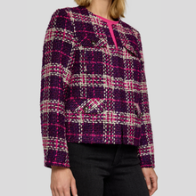 Load image into Gallery viewer, Plaid patterned sweater worn by a person on a plain background
