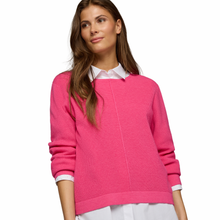Load image into Gallery viewer, Close view of model wearing Rabe Purple Clouds Jumper in Fuchsia, on a white background.
