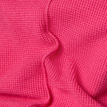 Load image into Gallery viewer, Close up of fabric on the Rabe Purple Clouds Jumper in Fuchsia, on a white background.
