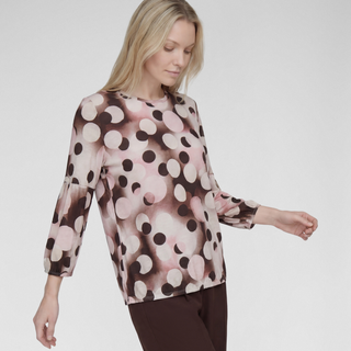 Woman in top and trouser on grey background 