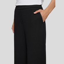 Load image into Gallery viewer, Trousers on Model on Light Grey Background 
