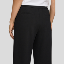 Load image into Gallery viewer, Trousers on Model on Light Grey Background 
