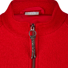 Load image into Gallery viewer, Close-up of a bright red fleece zip-up jacket with a silver-tone zipper and a decorative rhinestone tassel pull, showing the inner neck label with a stylized 'EB' logo.
