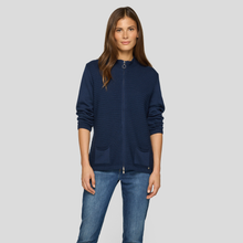 Load image into Gallery viewer, Woman wearing a navy blue zip-up hoodie and jeans on a gray background
