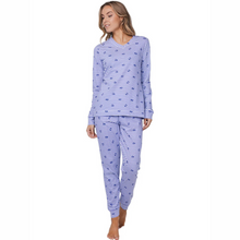 Load image into Gallery viewer, Woman wearing a blue and white striped pajama set on a white background
