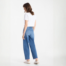 Load image into Gallery viewer, Woman wearing blue jeans and a white shirt on a white background
