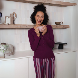 Lady in Pyjamas in Kitchen