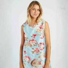Load image into Gallery viewer, Woman wearing a light blue floral dress on a white background

