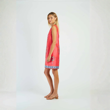 Load image into Gallery viewer, Woman wearing a red dress with a pattern on a white background
