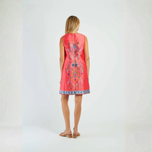 Load image into Gallery viewer, Woman wearing a coral dress with colorful embroidery on a white background
