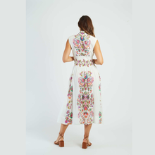 Load image into Gallery viewer, Woman wearing a white dress with colorful floral patterns on a white background
