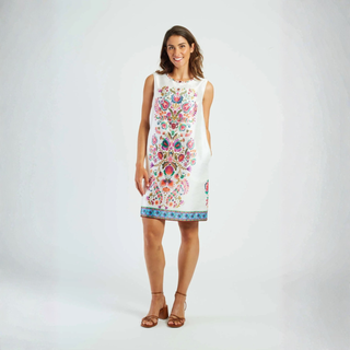 Woman wearing a floral dress on a white background
